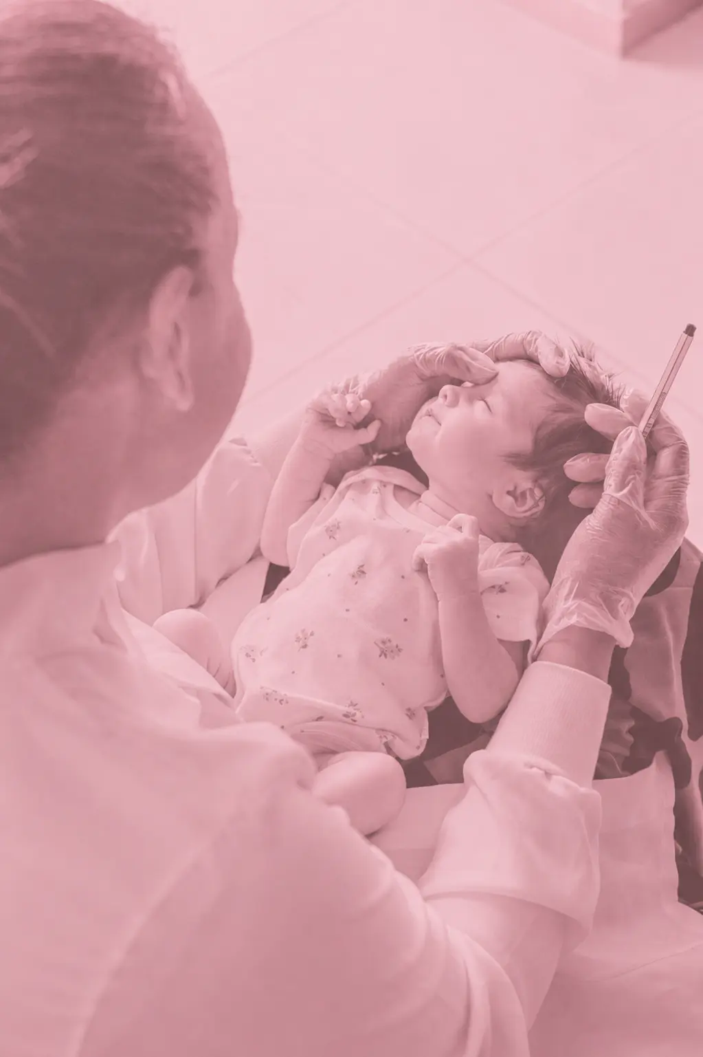 A paediatrician examining a young child